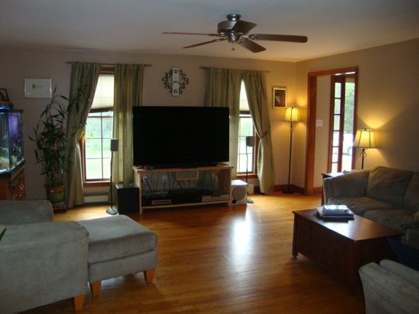 228 Braley Hill Road Rochester, MA 02770 - Photo 8 of 18 a living room with furniture and a flat screen tv
