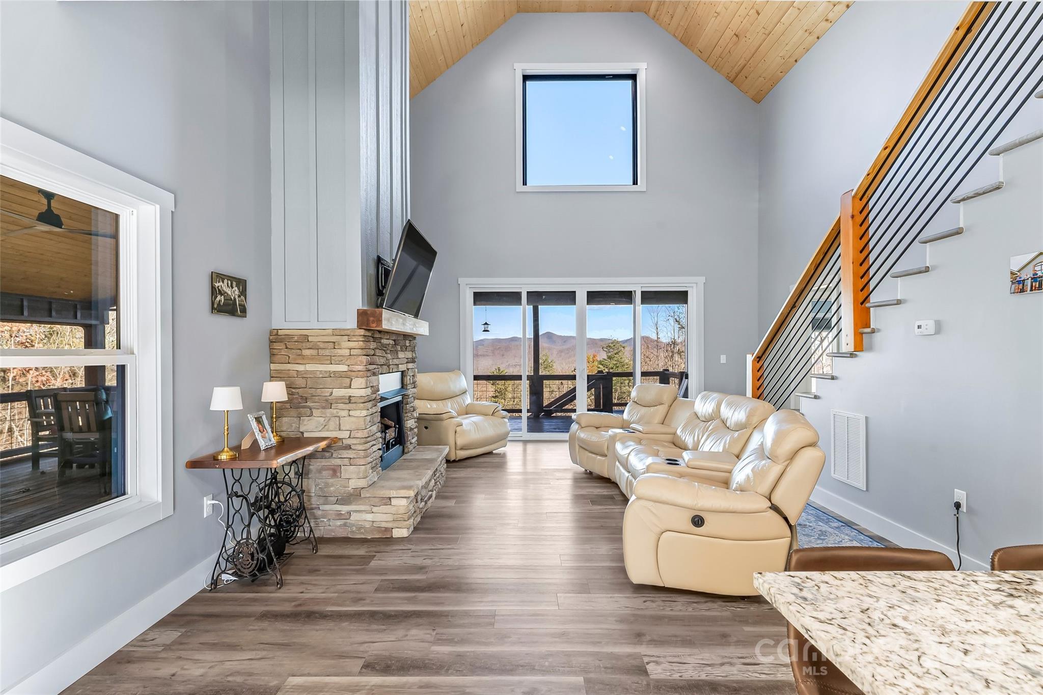 53 Cres Ridge Lane Nebo, NC 28761 - Photo 11 of 48 a living room with fireplace furniture and a flat screen tv