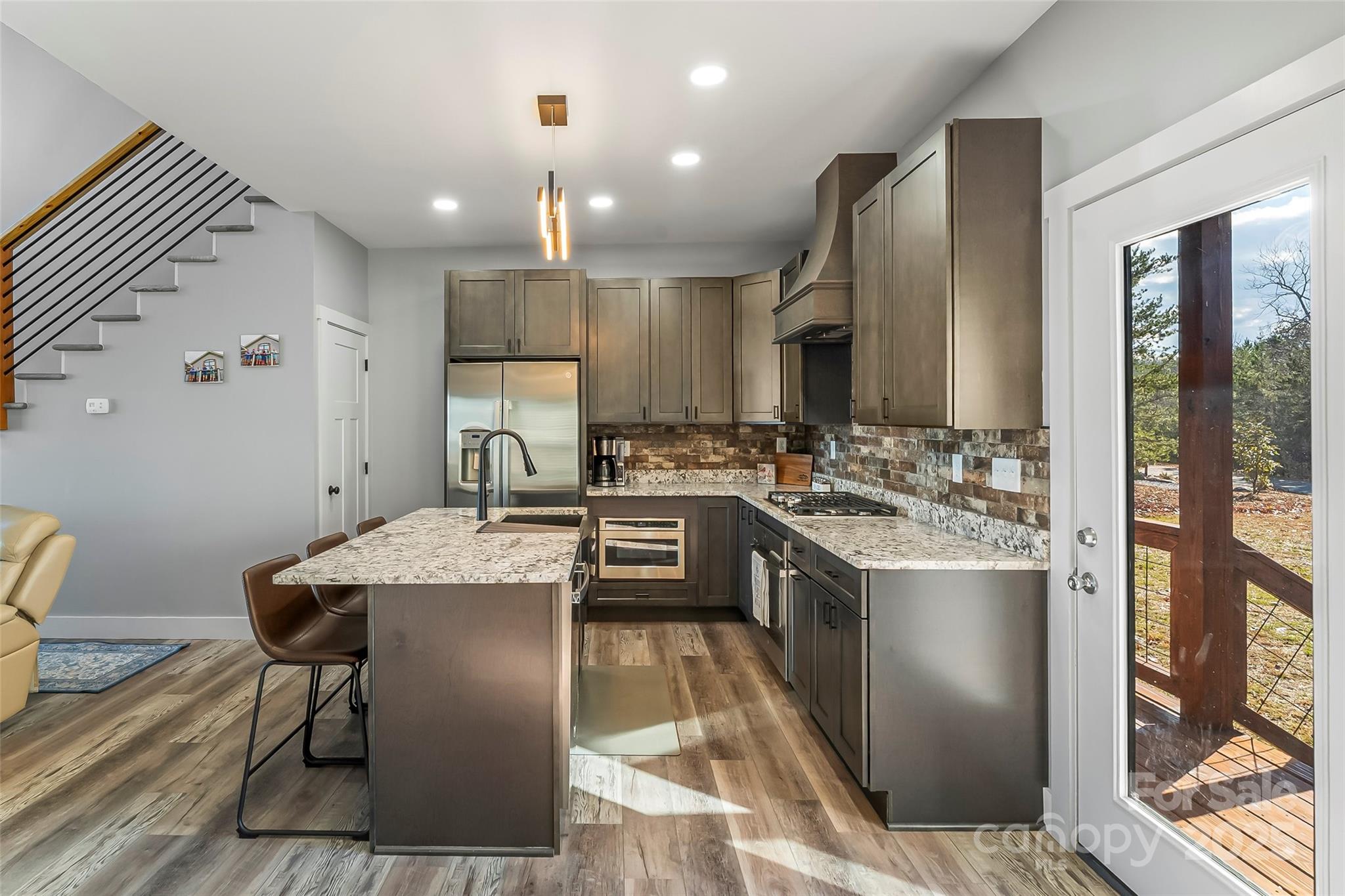 53 Cres Ridge Lane Nebo, NC 28761 - Photo 13 of 48 a kitchen with stainless steel appliances granite countertop a sink stove and refrigerator