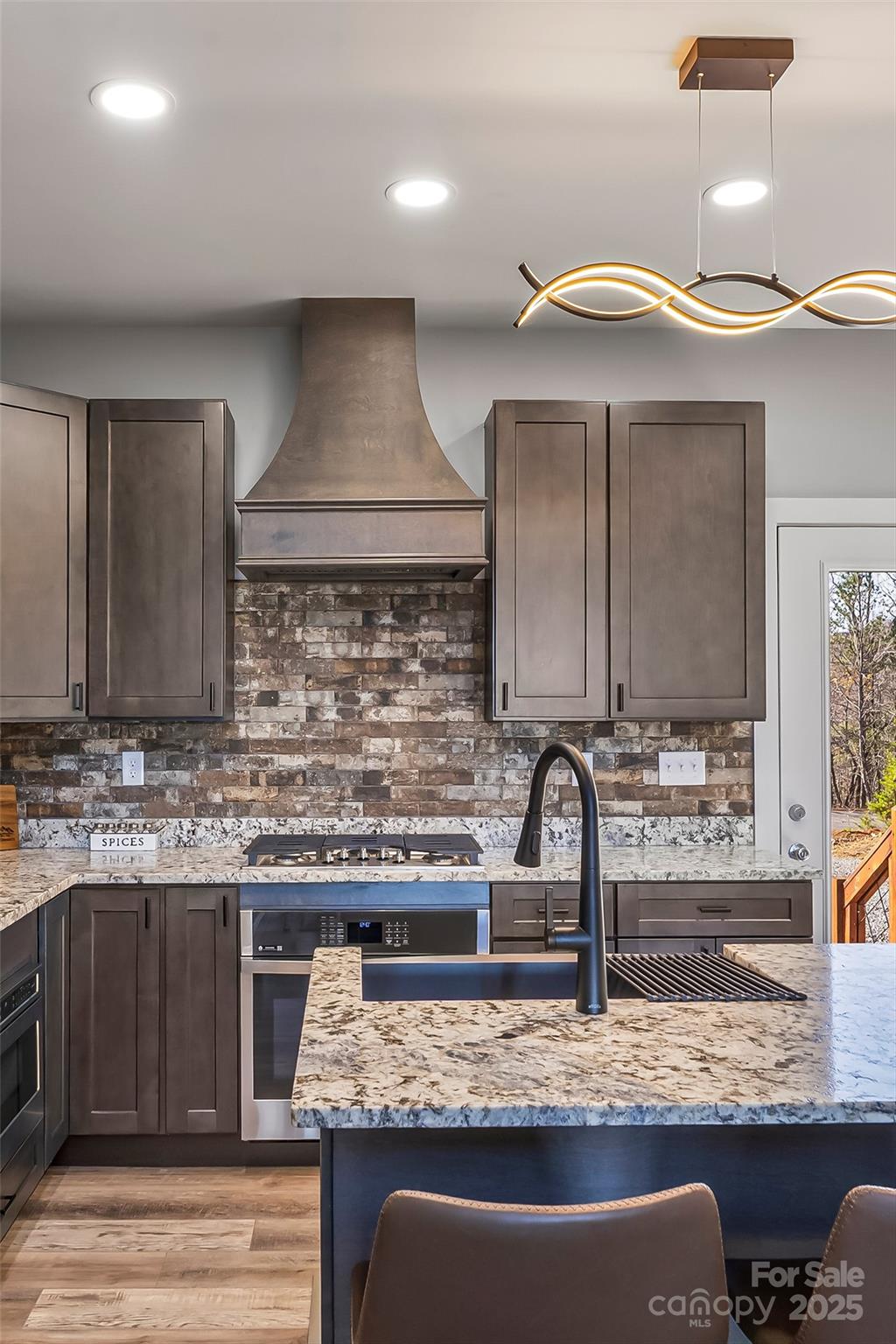 53 Cres Ridge Lane Nebo, NC 28761 - Photo 14 of 48 a kitchen with kitchen island granite countertop a sink a counter space and cabinets