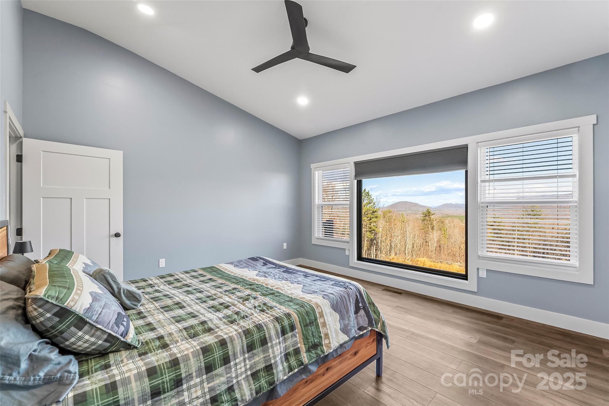 53 Cres Ridge Lane Nebo, NC 28761 - Photo 24 of 48 a bedroom with a bed and a large window