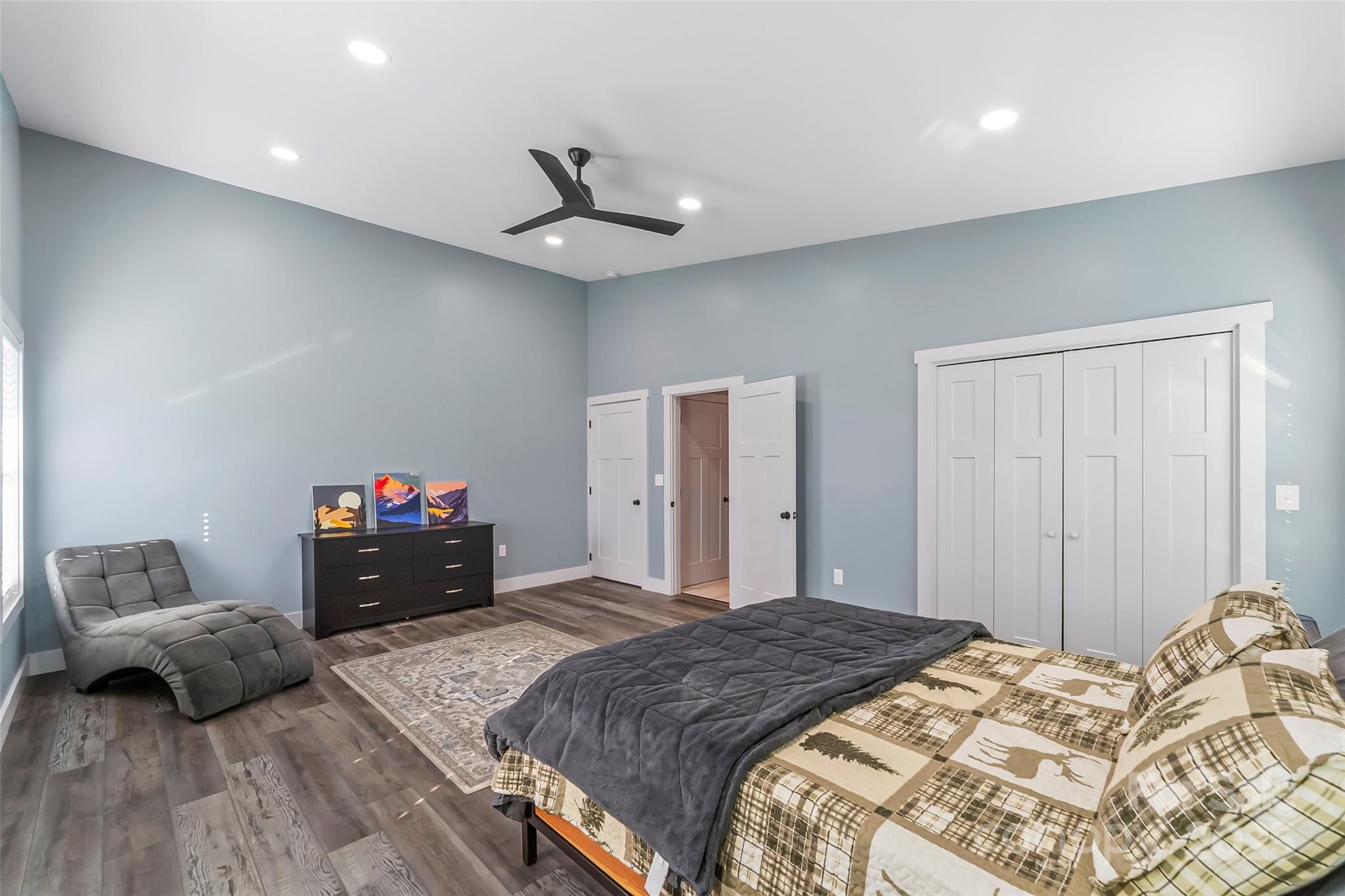 53 Cres Ridge Lane Nebo, NC 28761 - Photo 27 of 48 a bedroom with a bed and a chandelier
