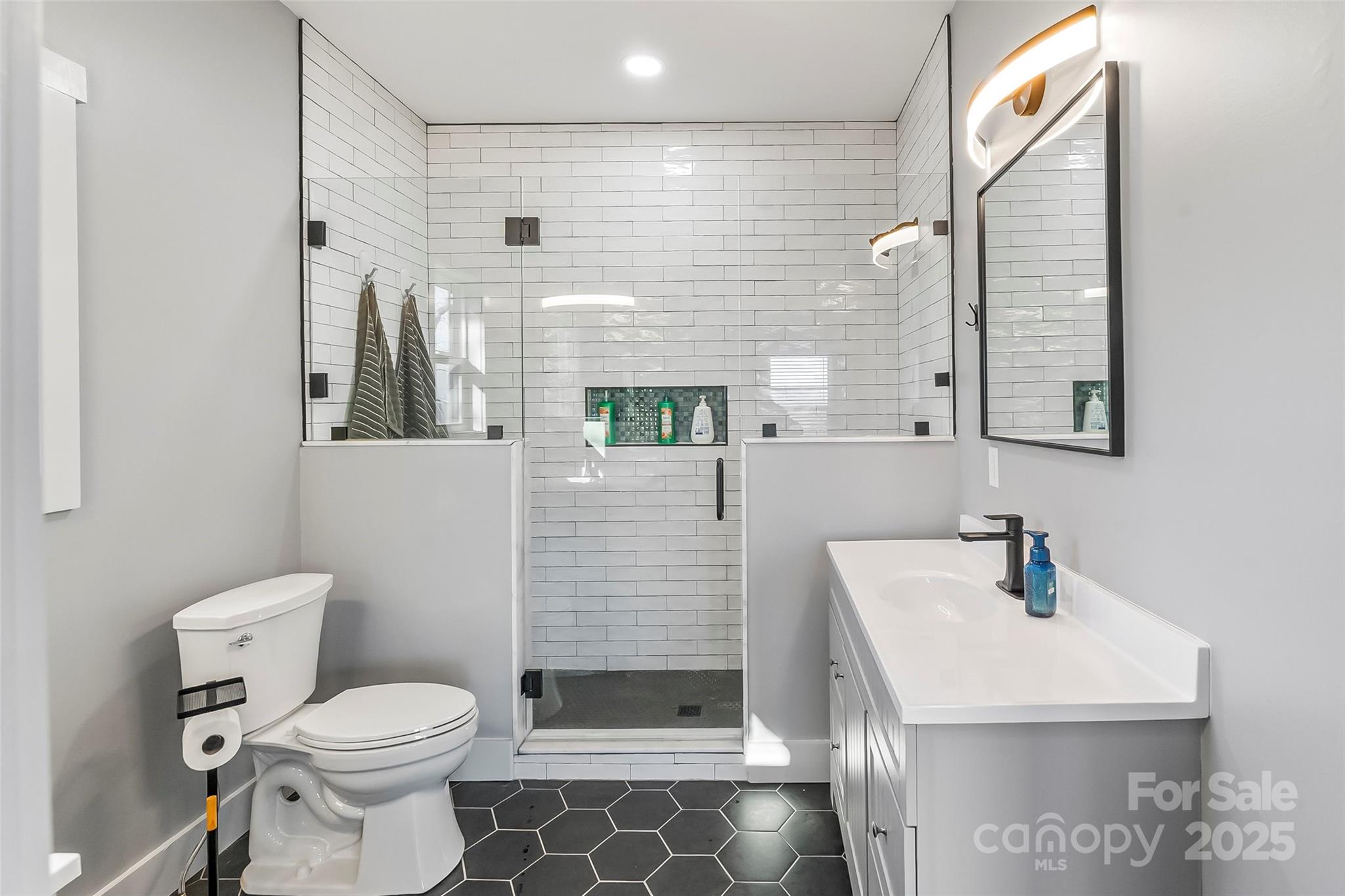 53 Cres Ridge Lane Nebo, NC 28761 - Photo 28 of 48 a bathroom with a sink a toilet and shower