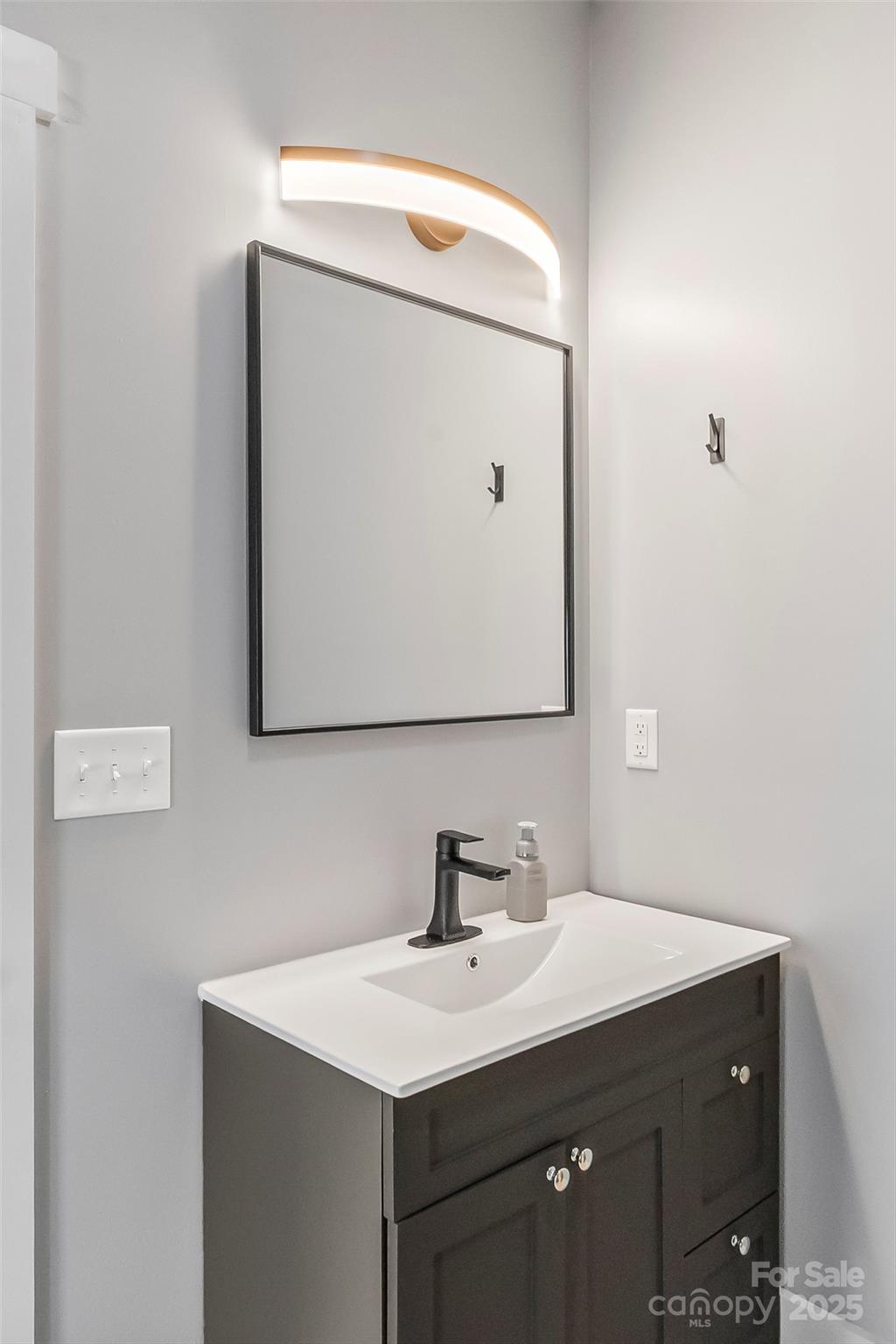 53 Cres Ridge Lane Nebo, NC 28761 - Photo 33 of 48 a bathroom with a sink vanity and a mirror