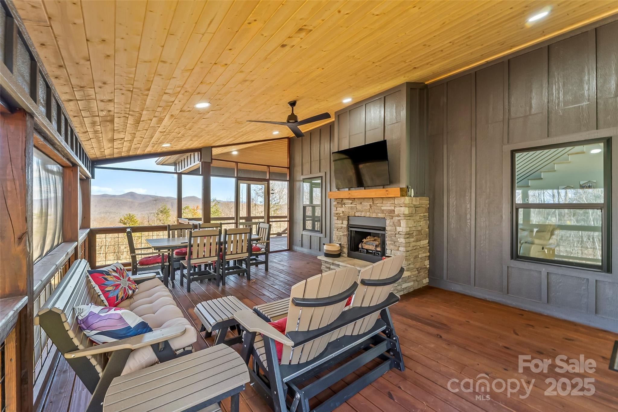 53 Cres Ridge Lane Nebo, NC 28761 - Photo 36 of 48 a living room with fireplace furniture and a flat screen tv