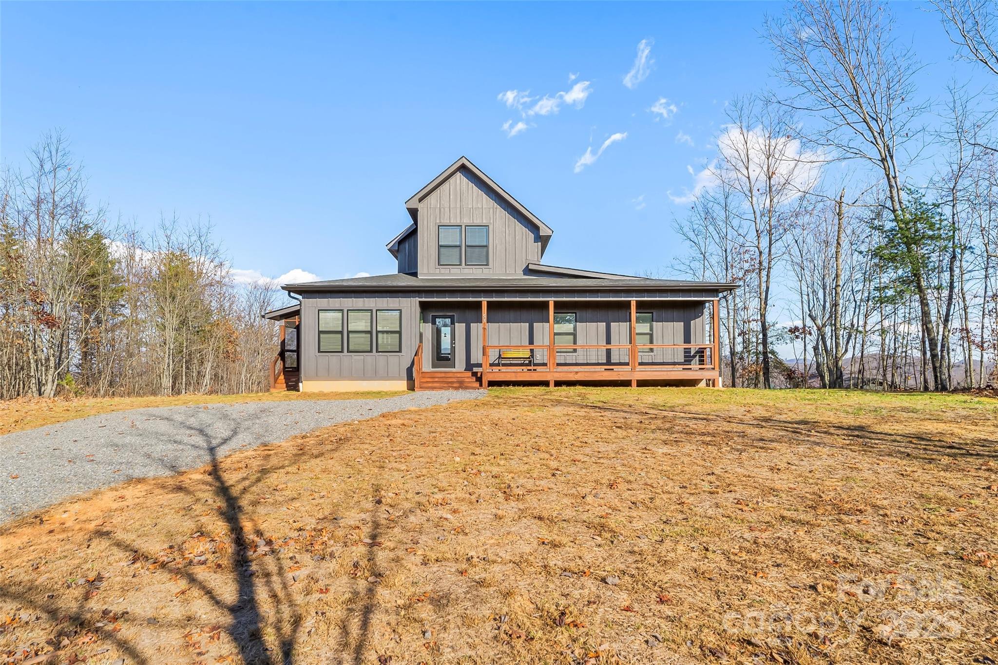 53 Cres Ridge Lane Nebo, NC 28761 - Photo 6 of 48 a front view of a house with a garden and yard