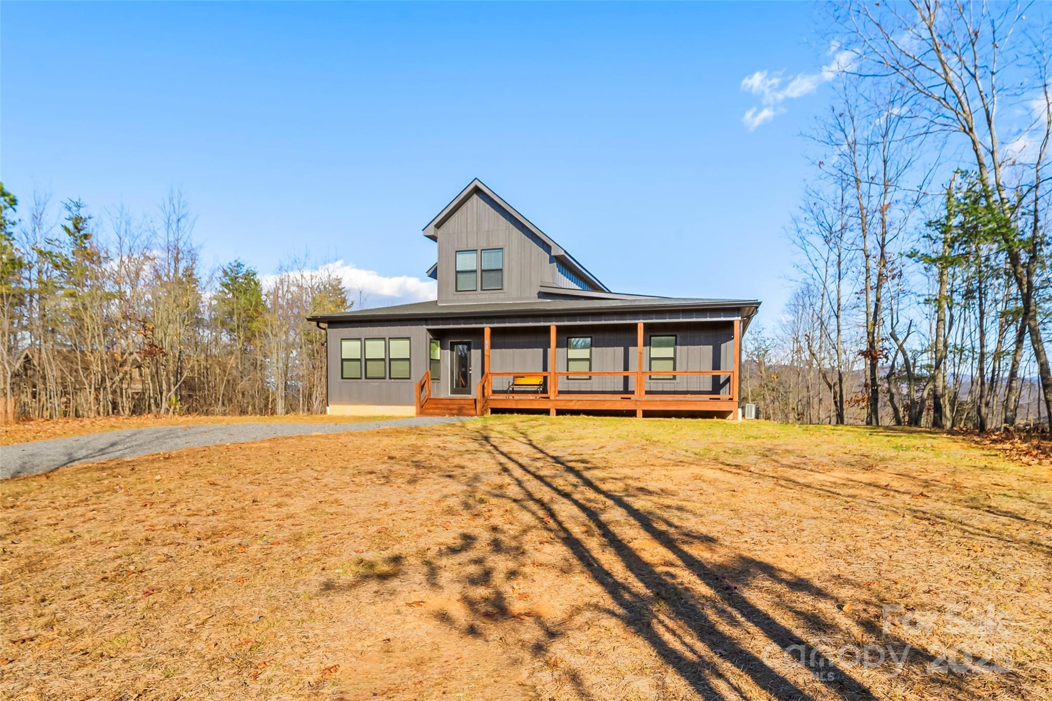 53 Cres Ridge Lane Nebo, NC 28761 - Photo 7 of 48 a front view of a house with a yard and garage
