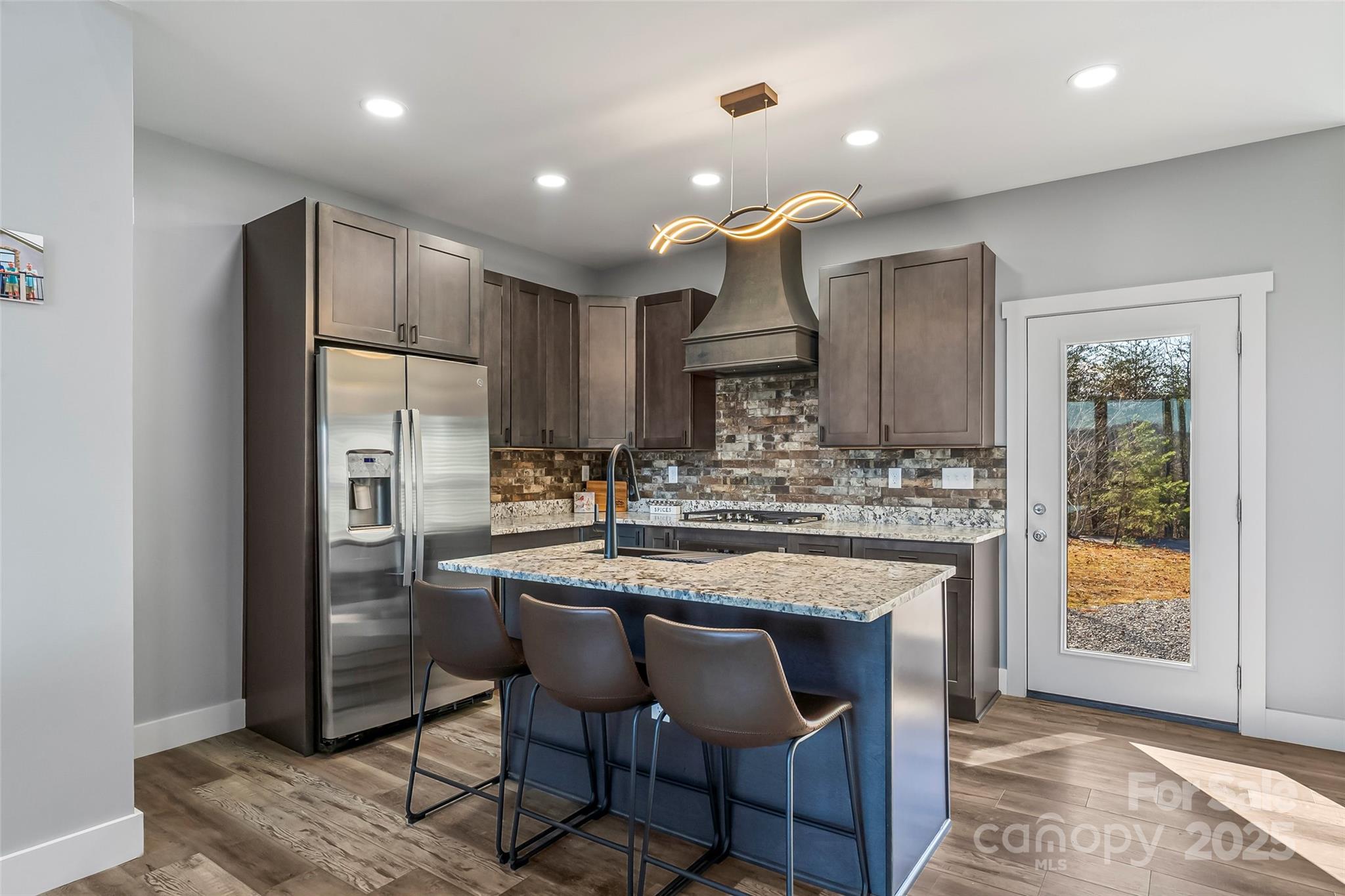 53 Cres Ridge Lane Nebo, NC 28761 - Photo 10 of 48 a kitchen with kitchen island granite countertop a sink and refrigerator