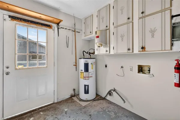 a view of cabinets with white wooden cabinet