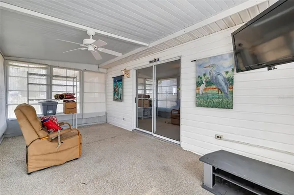 a living room with furniture and flat screen tv