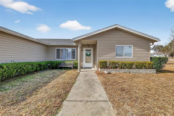 a view of a house with backyard