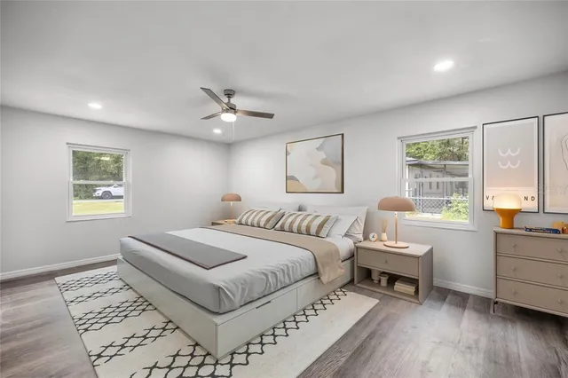 a spacious bedroom with a large bed and a window