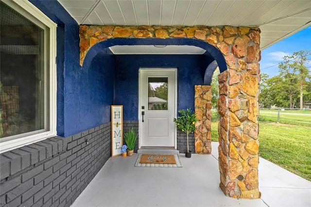 a view of a wooden door of the house