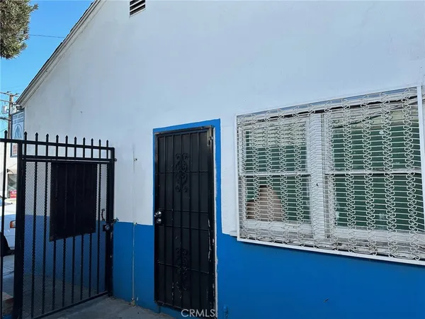 a view of car parked in front of a building