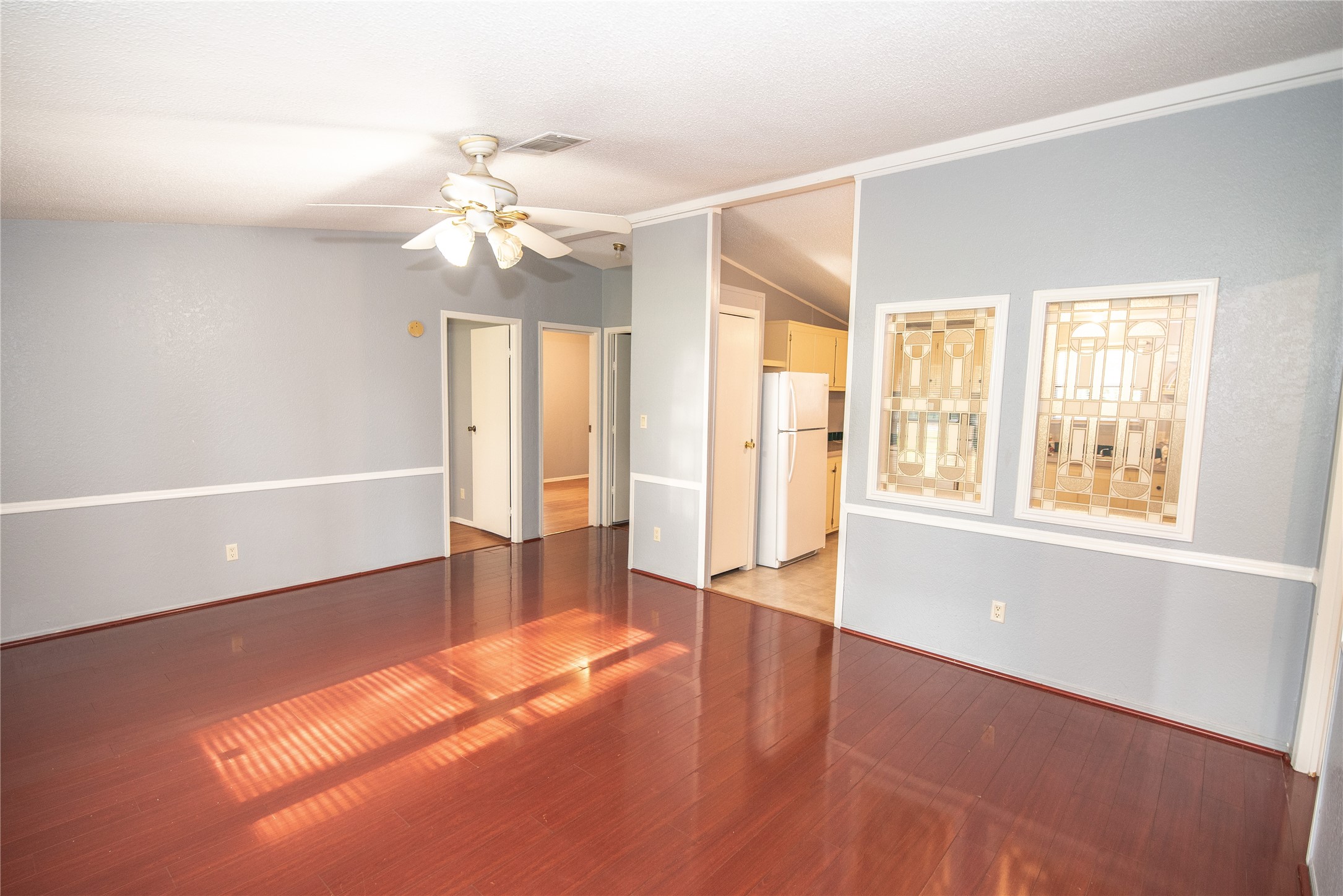 11804 Trickey Road Houston, TX 77067 - Photo 2 of 9 wooden floor in an empty room with a window