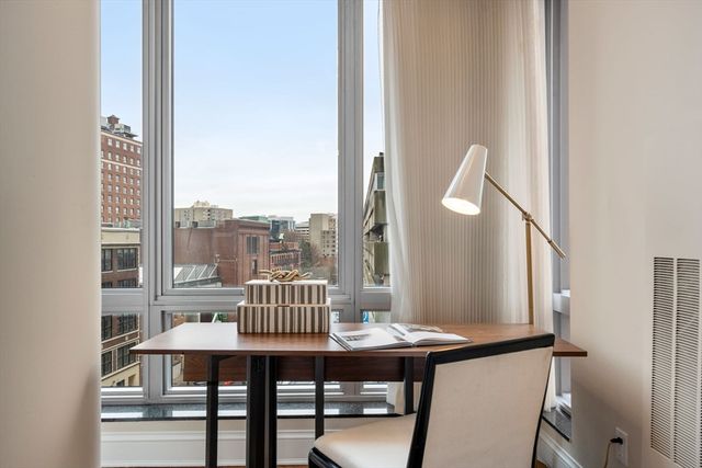 a view of a balcony with furniture