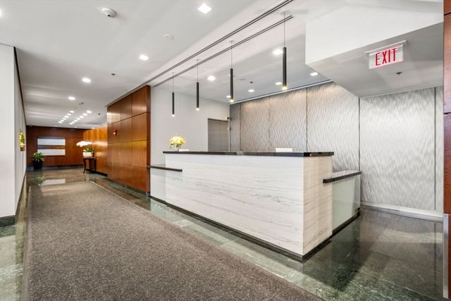 a view of a hallway with kitchen island