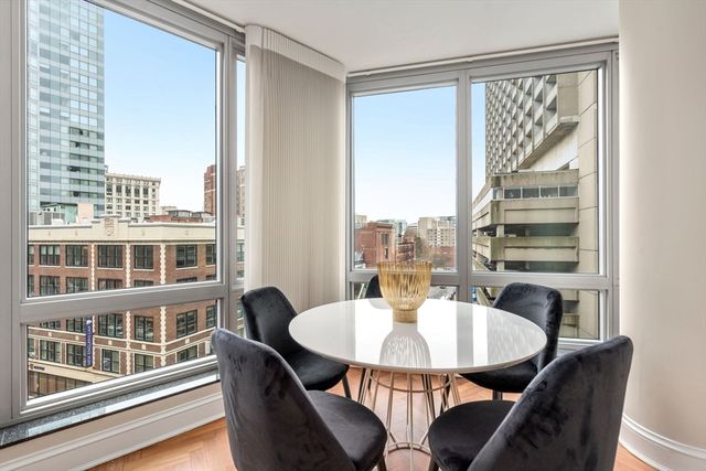 a dining room with furniture and wooden floor