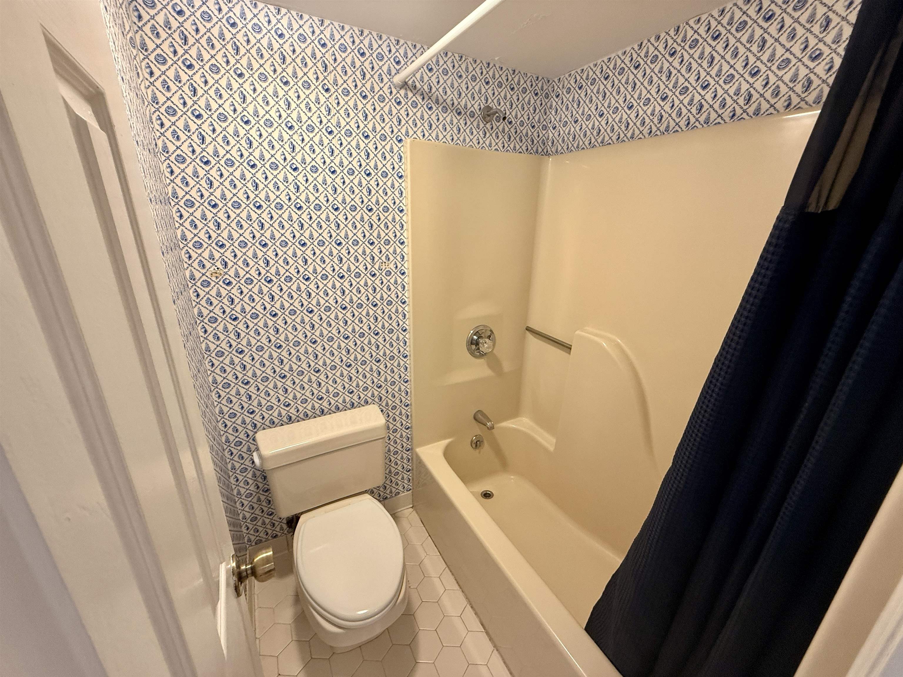 4230 Pinehurst Circle, Unit K4 Little River, SC 29566 - Photo 11 of 25 Full bathroom featuring shower / bath combination with curtain and tile patterned flooring