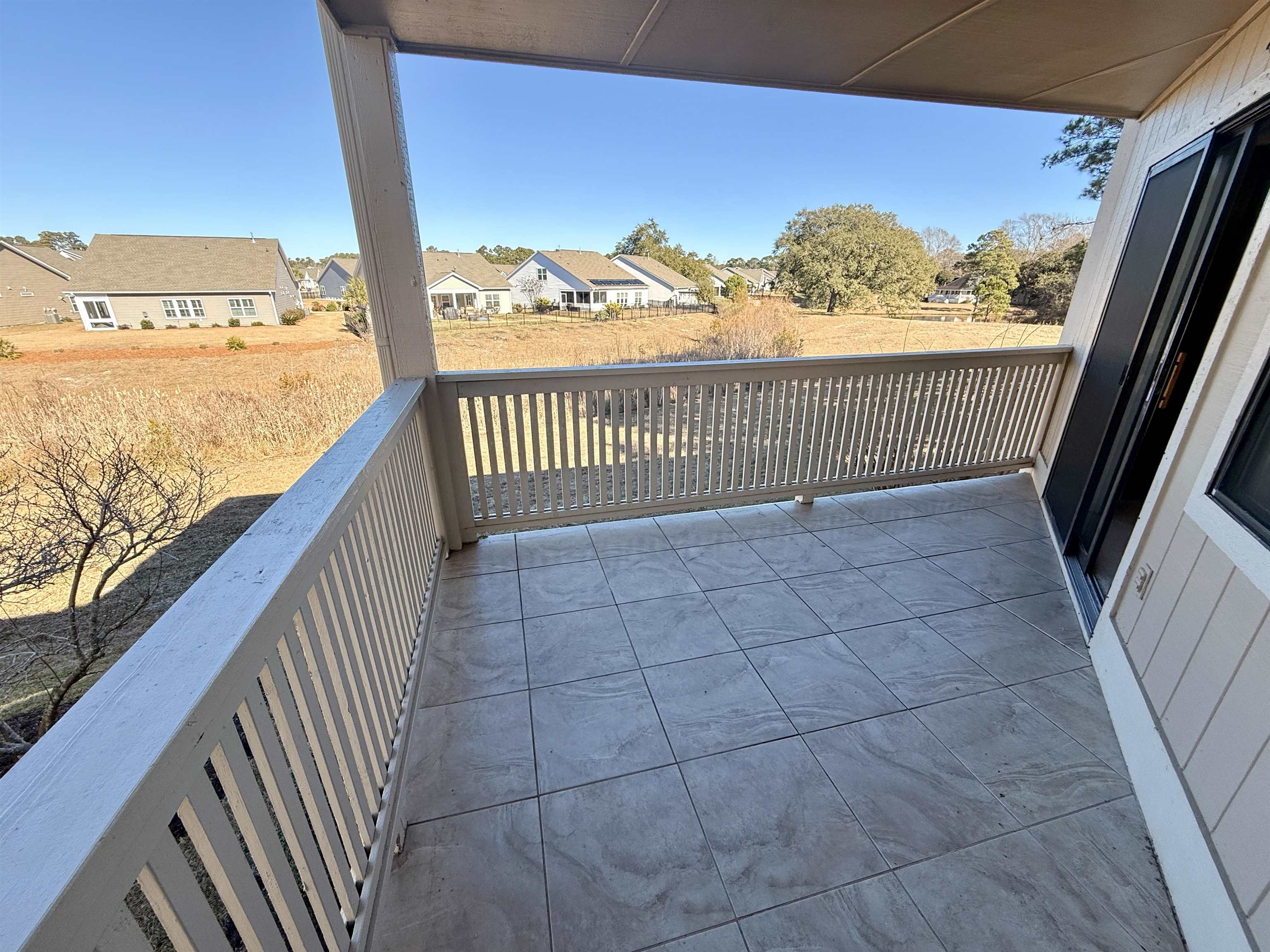 4230 Pinehurst Circle, Unit K4 Little River, SC 29566 - Photo 14 of 25 Balcony featuring a residential view and a sunroom