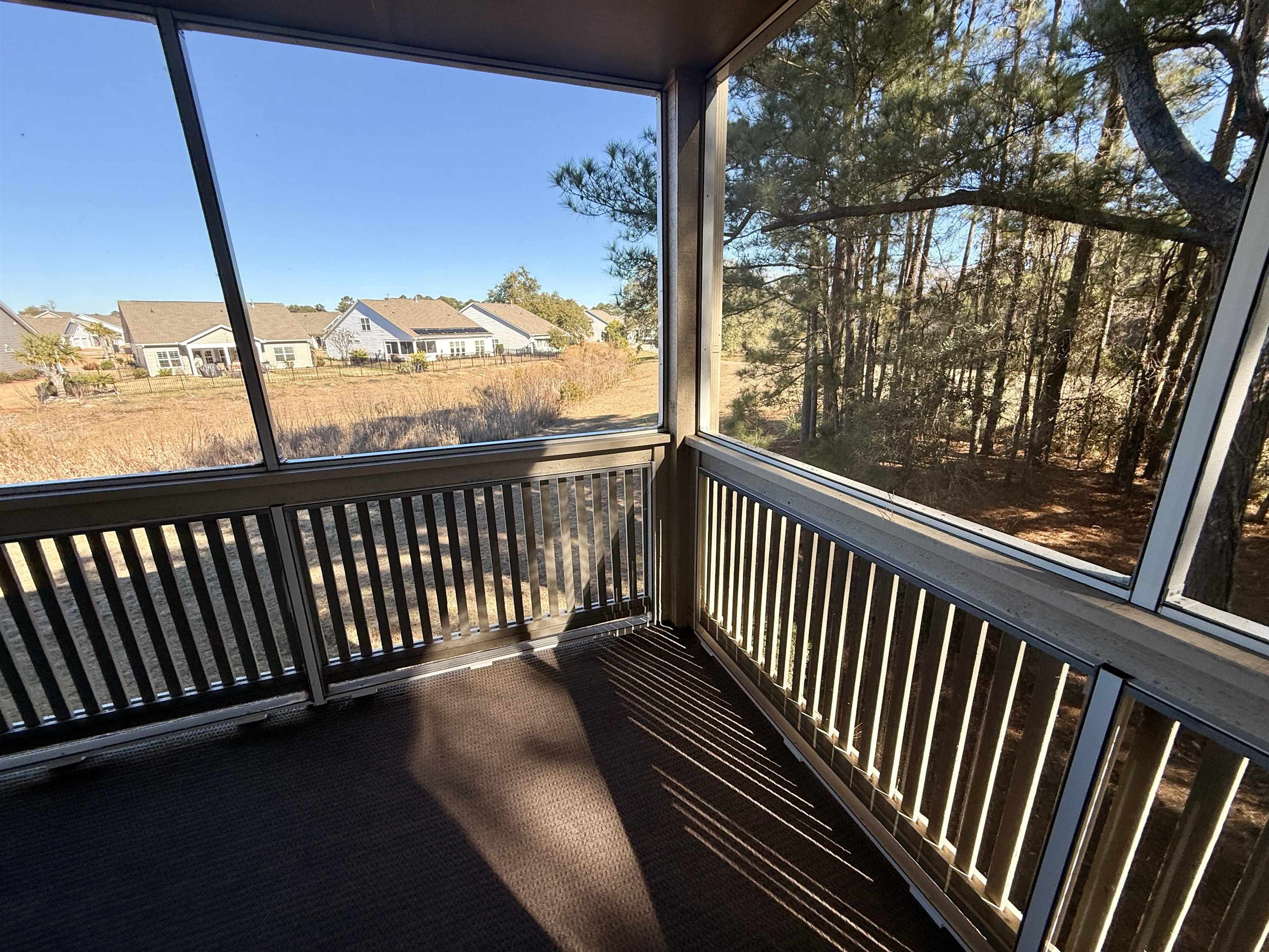 4230 Pinehurst Circle, Unit K4 Little River, SC 29566 - Photo 15 of 25 Balcony with a sunroom and a residential view