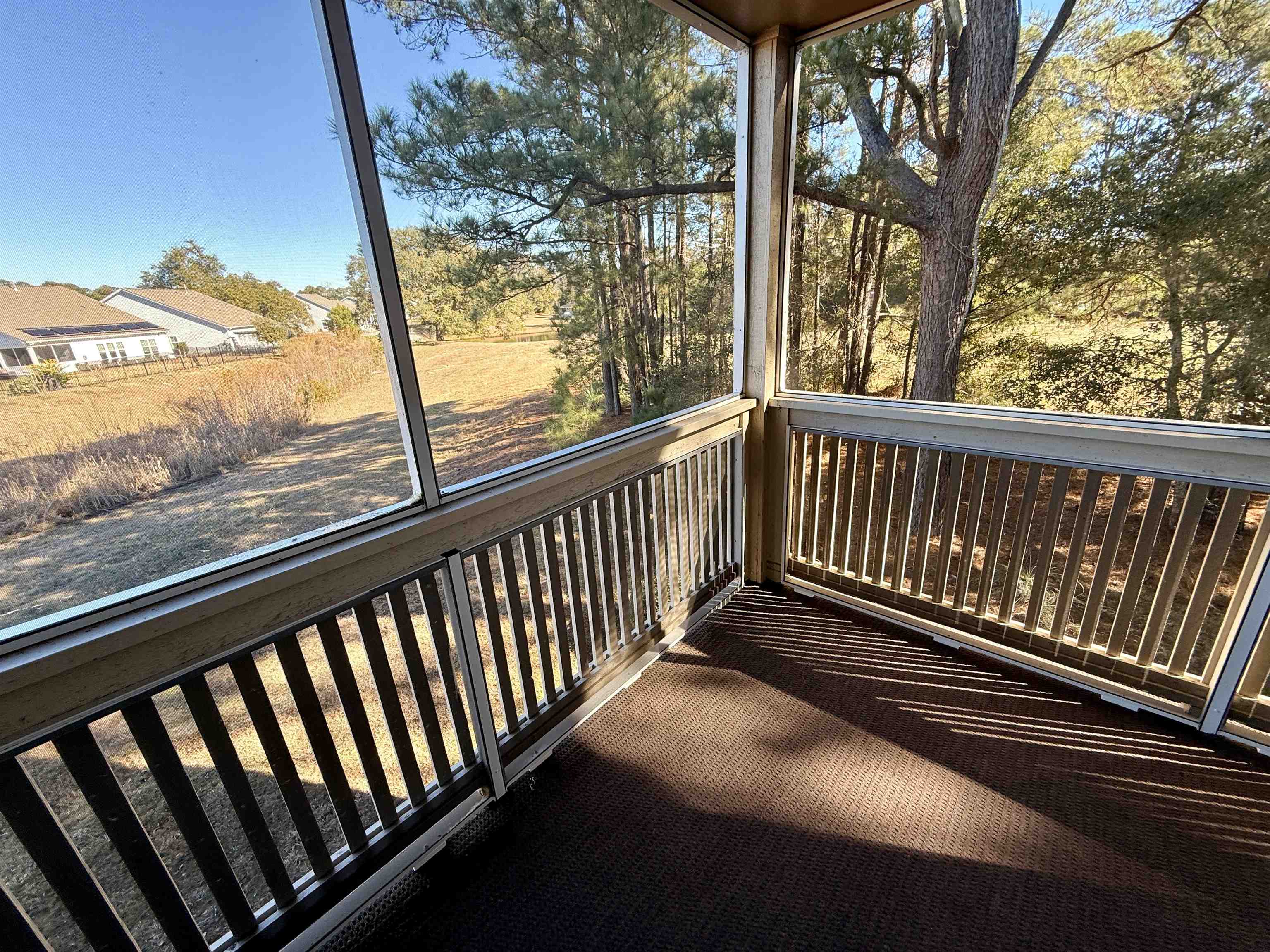 4230 Pinehurst Circle, Unit K4 Little River, SC 29566 - Photo 16 of 25 Unfurnished sunroom featuring healthy amount of natural light