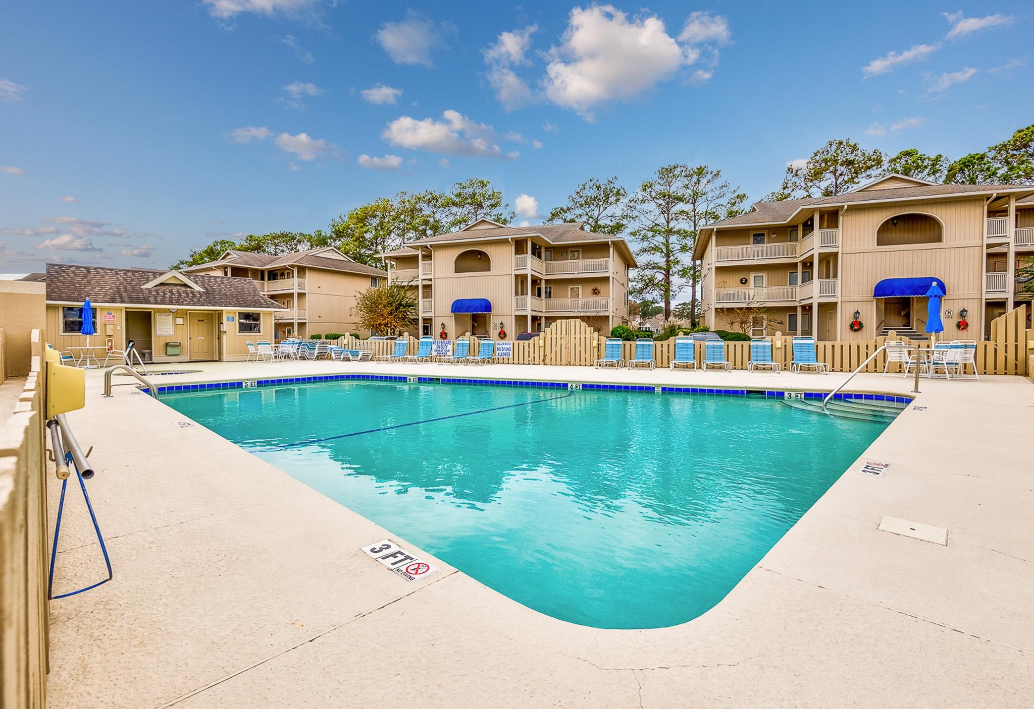 4230 Pinehurst Circle, Unit K4 Little River, SC 29566 - Photo 18 of 25 Community pool featuring a patio