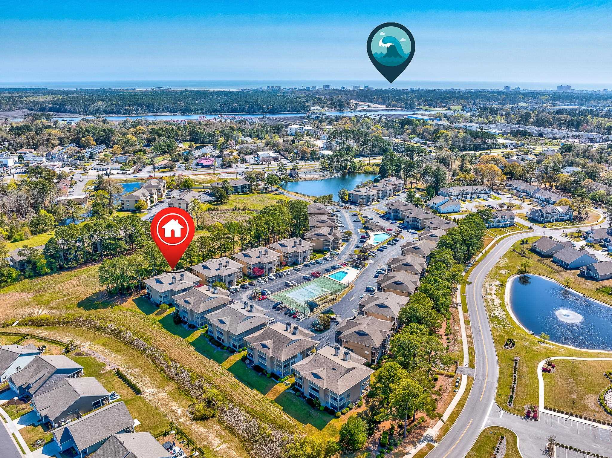 4230 Pinehurst Circle, Unit K4 Little River, SC 29566 - Photo 22 of 25 Aerial overview of property's location with a large body of water and nearby suburban area