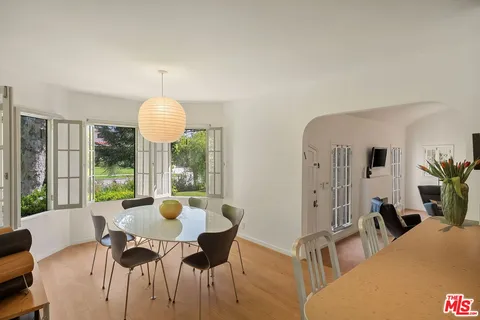 a view of a dining room with furniture window and outside view