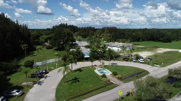 an aerial view of a house with a swimming pool