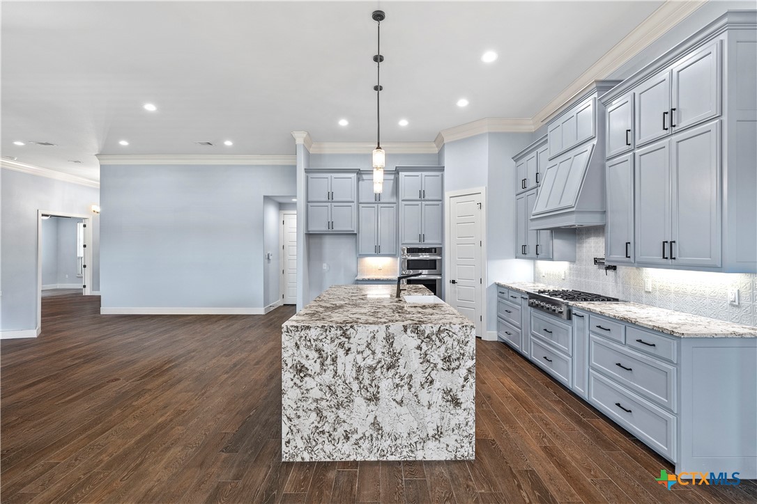 1606 Alta Vista Loop Temple, TX 76502 - Photo 16 of 48 a kitchen with stainless steel appliances granite countertop a sink stove and refrigerator