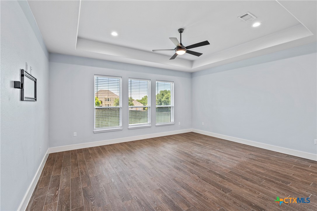 1606 Alta Vista Loop Temple, TX 76502 - Photo 20 of 48 a view of room window ceiling fan and hardwood floor