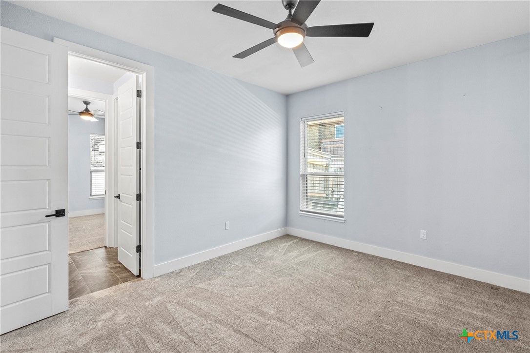 1606 Alta Vista Loop Temple, TX 76502 - Photo 29 of 48 an empty room with fan and windows