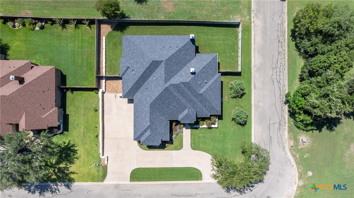 1606 Alta Vista Loop Temple, TX 76502 - Photo 47 of 48 an aerial view of a house with a garden and lake view