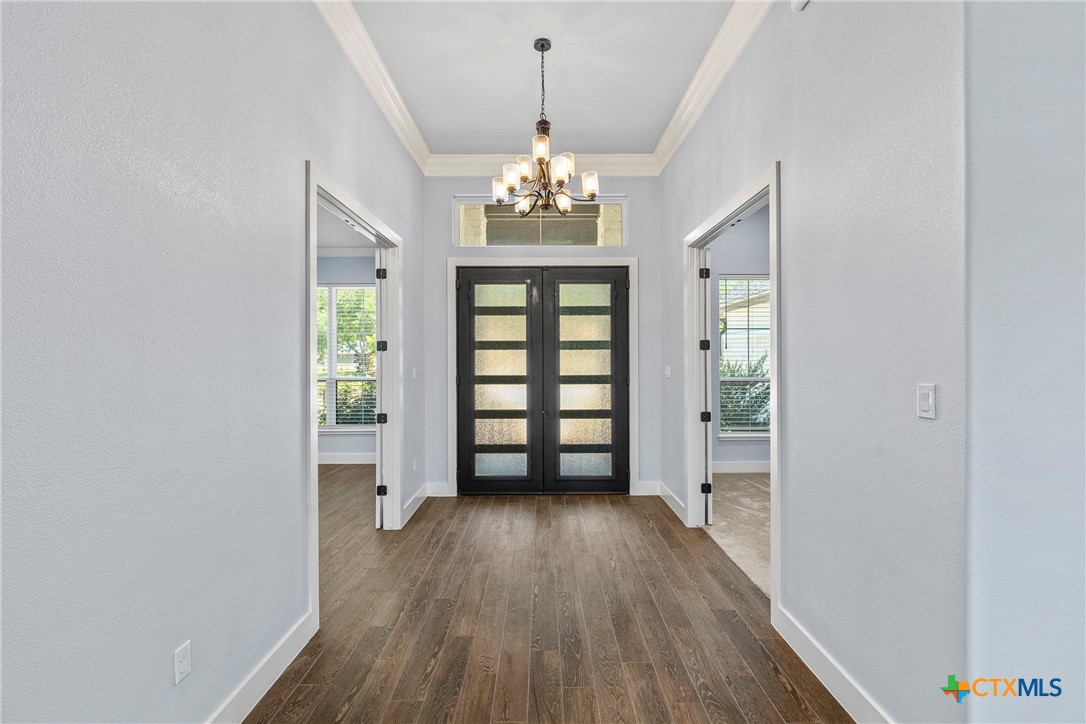 1606 Alta Vista Loop Temple, TX 76502 - Photo 9 of 48 wooden floor in an empty room with a window