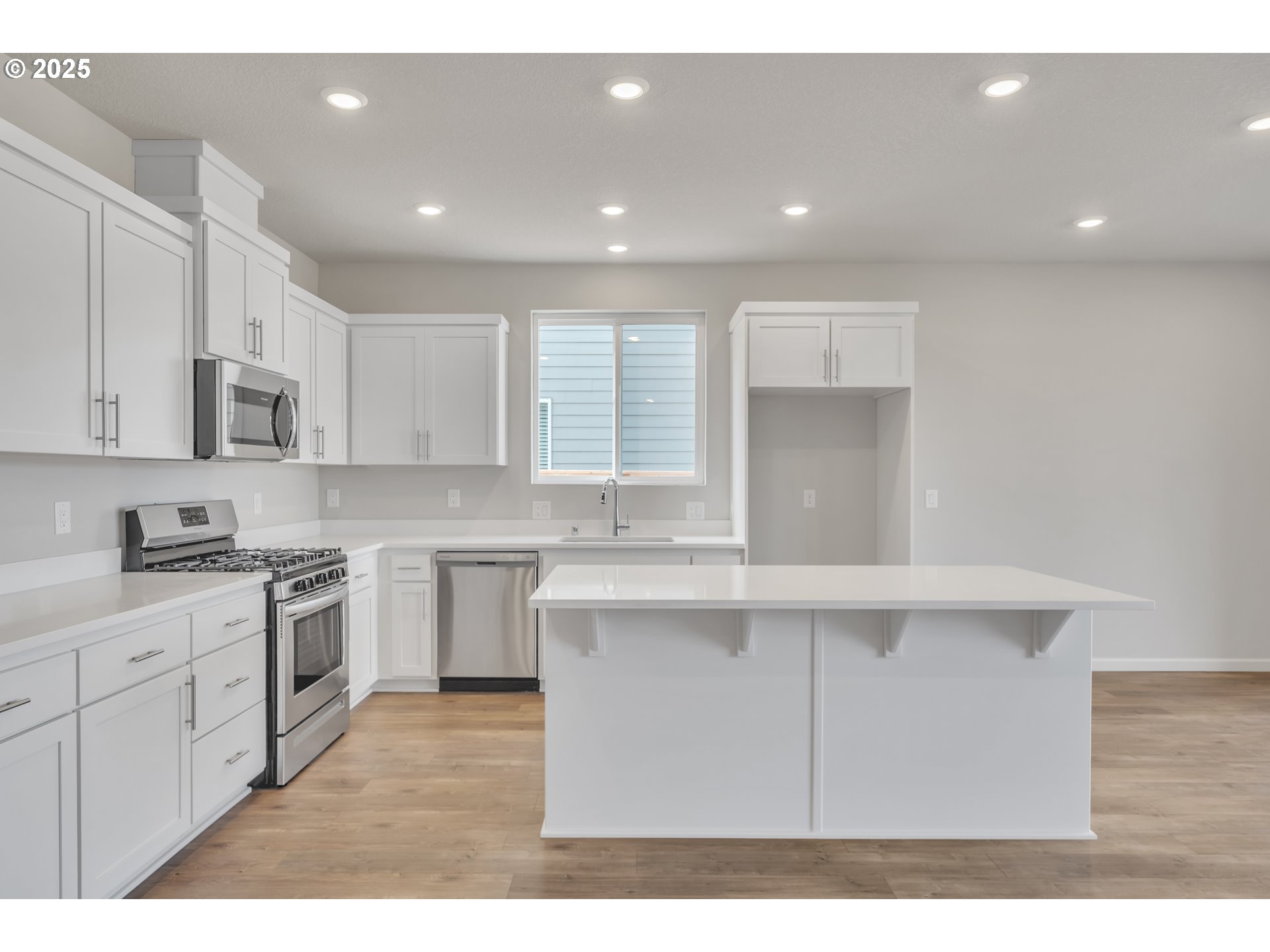 Undisclosed Address Albany, OR 97322 - Photo 30 of 42 a kitchen with white cabinets appliances and sink