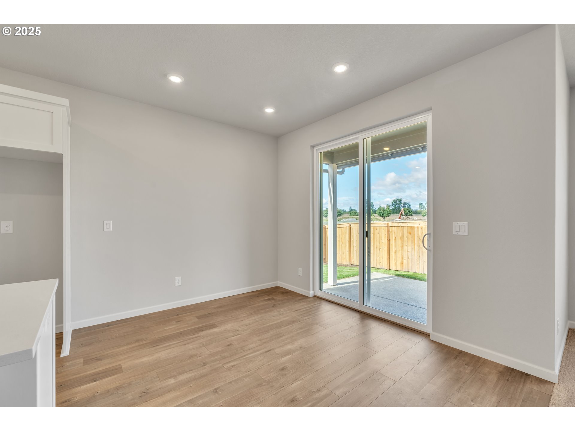 Undisclosed Address Albany, OR 97322 - Photo 31 of 42 a view of an empty room with wooden floor and a window