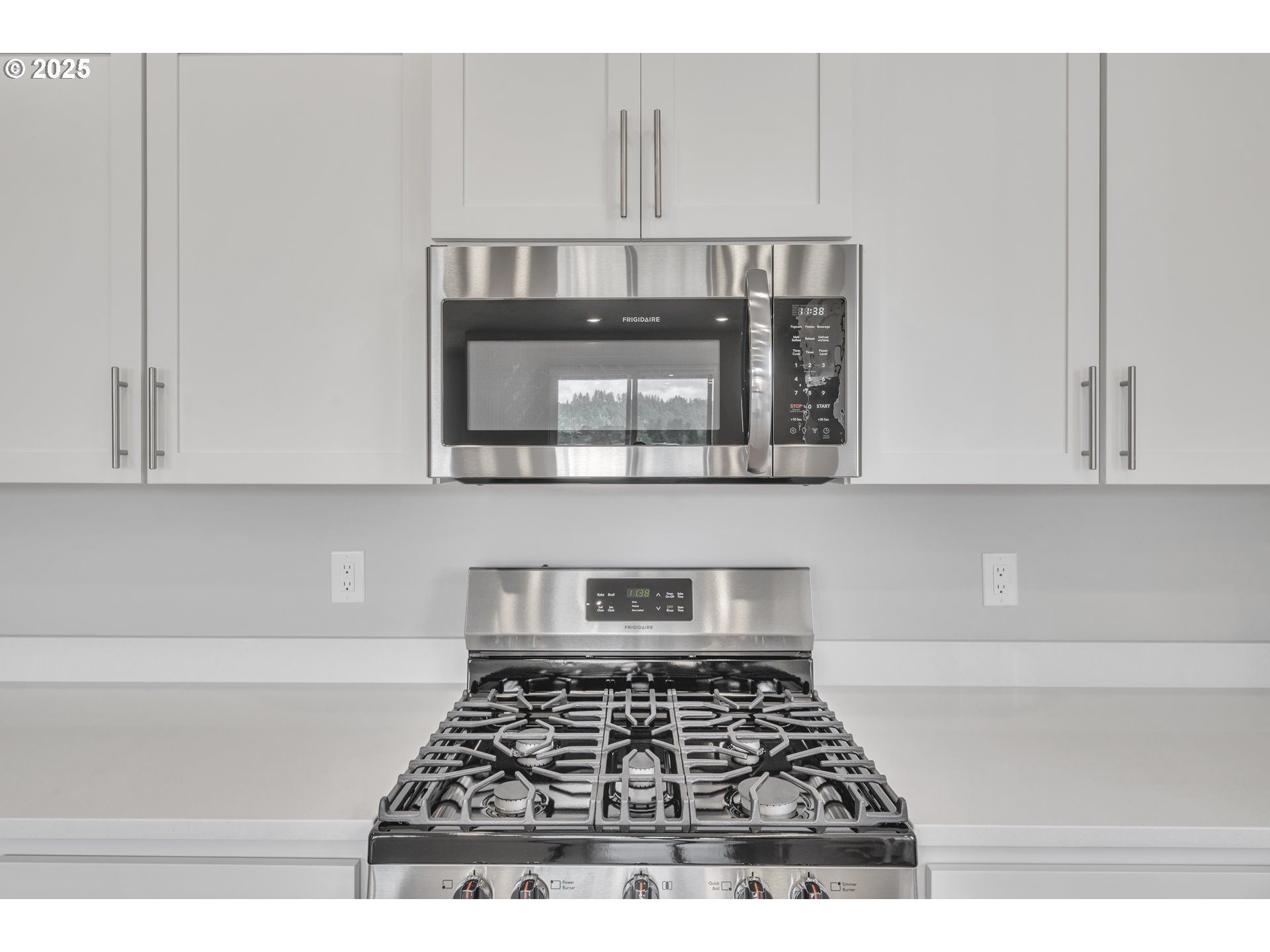 Undisclosed Address Albany, OR 97322 - Photo 33 of 42 a kitchen with cabinets and a stove top oven