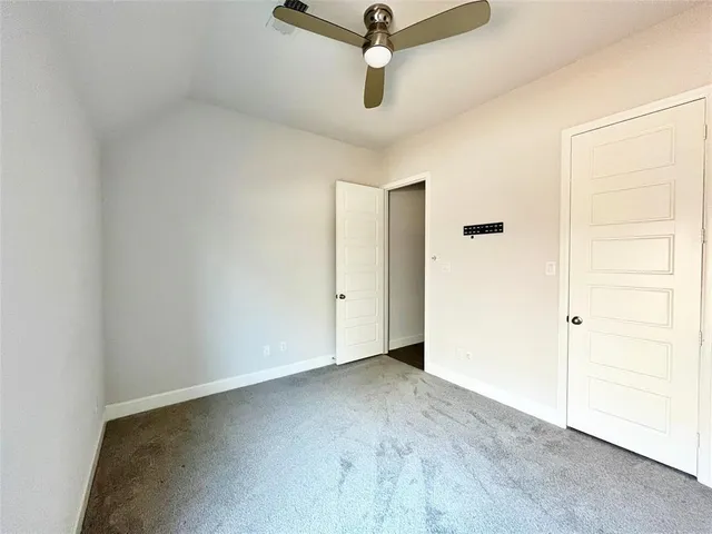 a bedroom with a bed and flat screen tv