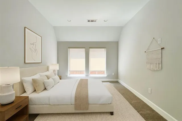 a bathroom with a toilet sink and a mirror