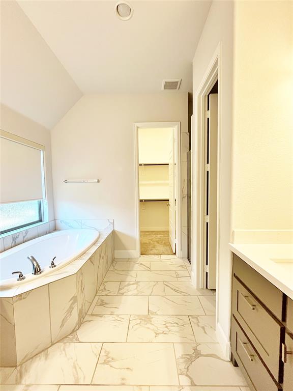 1505 Misty Pasture Way Mansfield, TX 76063 - Photo 19 of 31 a bathroom with a bathtub and a sink