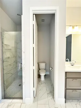 a bathroom with a tub and shower