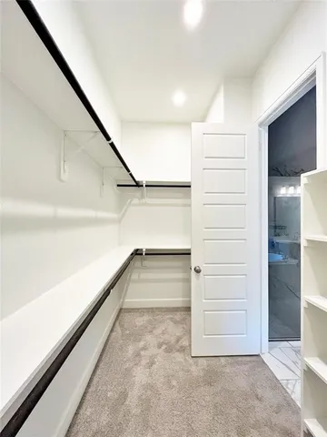 a spacious bathroom with a double vanity sink and a mirror