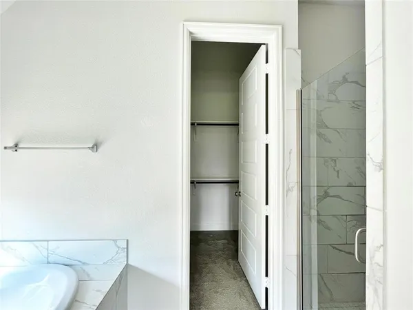 a spacious bathroom with a double vanity sink and a mirror