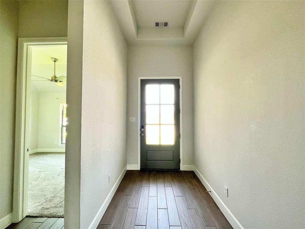 1505 Misty Pasture Way Mansfield, TX 76063 - Photo 3 of 31 an empty room with wooden floor and a window