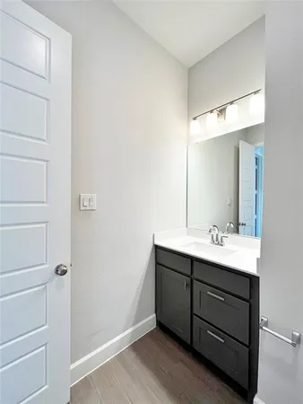 a bathroom with a sink toilet a mirror and shower