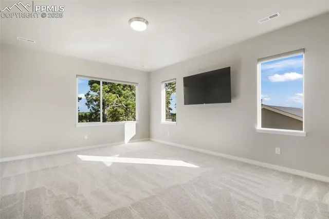 a large white kitchen with a large window
