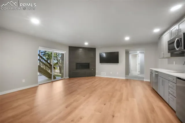 an empty room with a kitchen