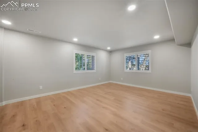 a view of a kitchen with a sink cabinets and a fireplace