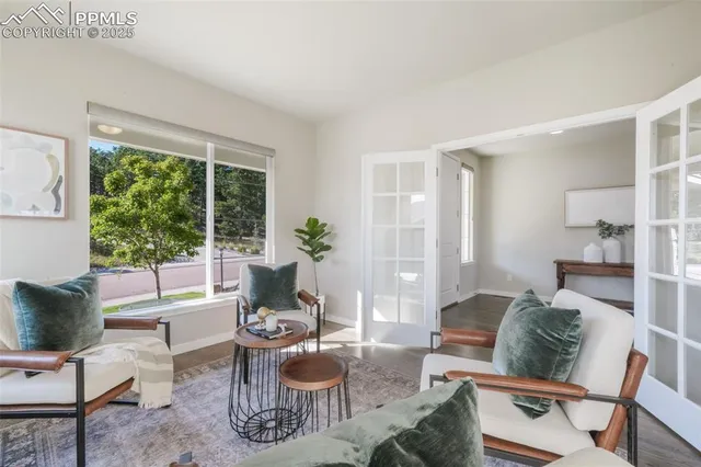 a large kitchen with stainless steel appliances granite countertop a lot of counter space and wooden floor